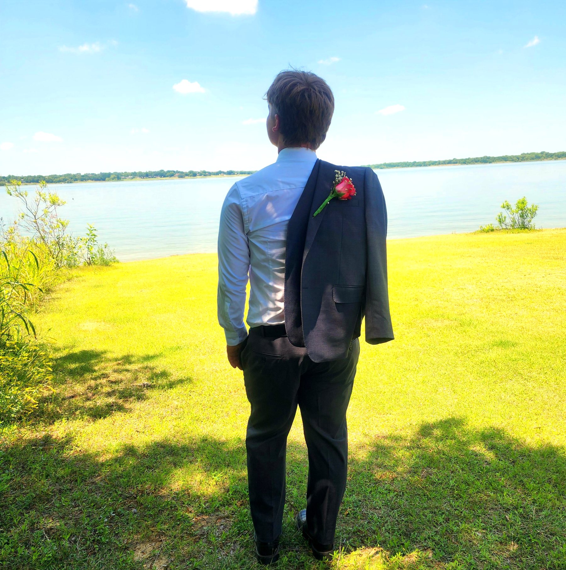 A man enjoying a peaceful moment by the lake